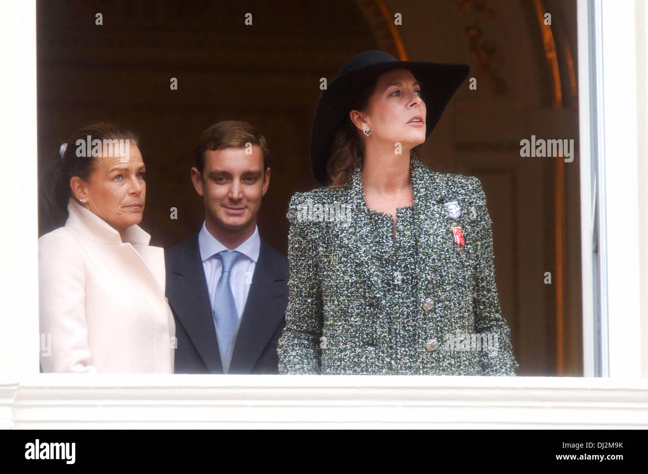 Monte Carlo, Monaco. 19th Nov, 2013. Princess Caroline of Hanover (R), her sister Princess Stephanie of Monaco and her son Pierre Casiraghi attend the Army Parade, as part of the official ceremonies for the Monaco National Day in Monte Carlo, Monaco, 19 November 2013. Photo: Albert Philip van der Werf/dpa/Alamy Live News Stock Photo