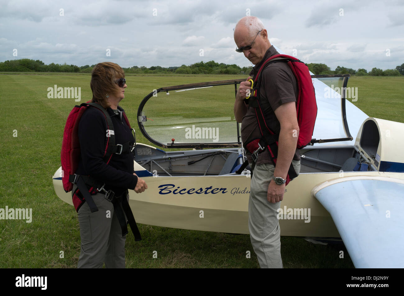 dh GLIDING UK Instructor showing woman glider parachute instruction