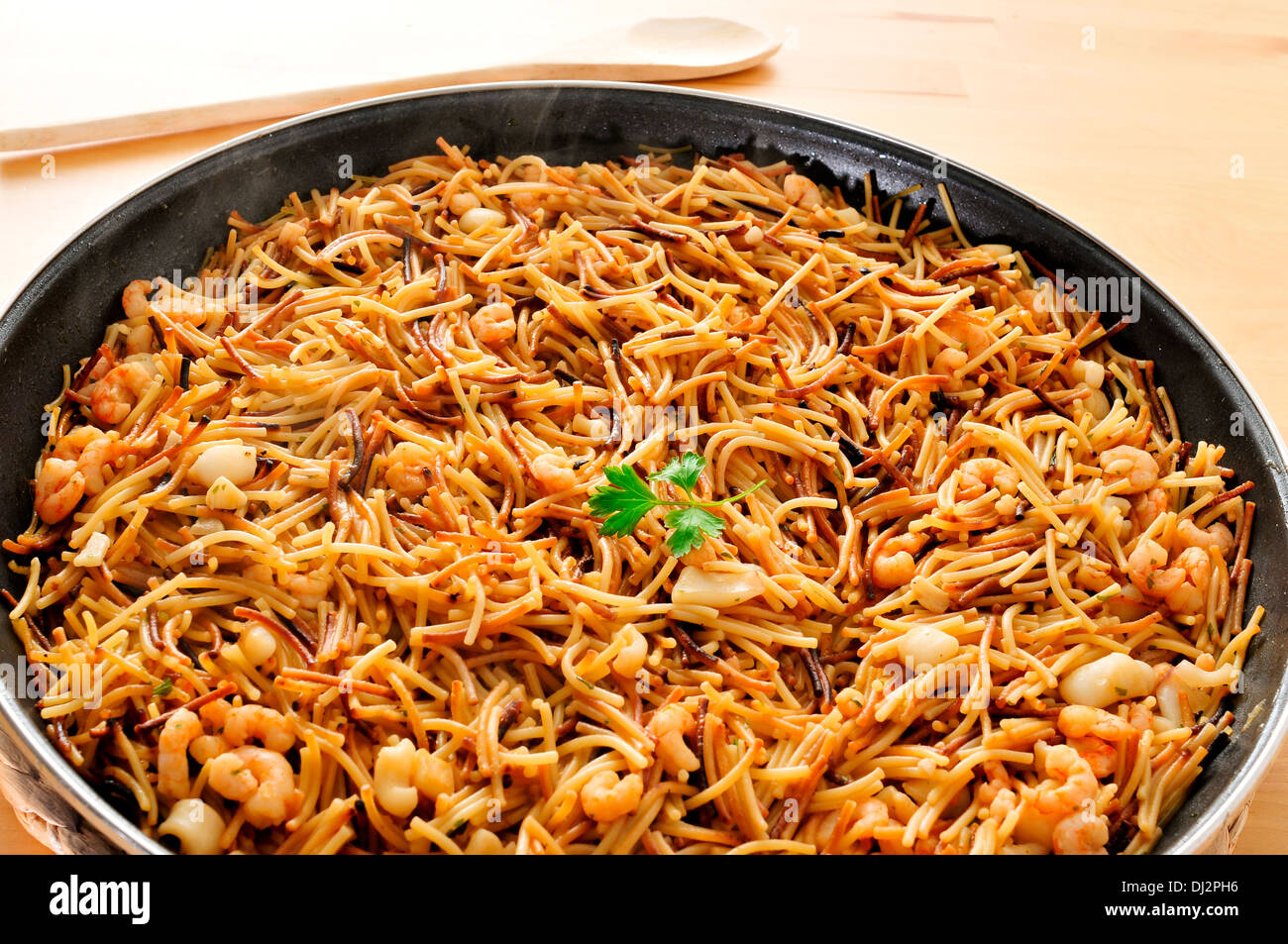 a spanish fideua, a typical noodles casserole with seafood Stock Photo -  Alamy