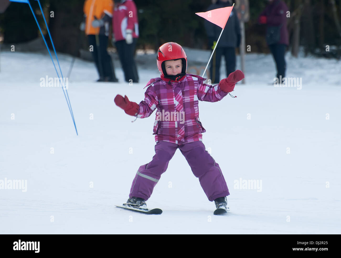 little girl driving on skis Stock Photo