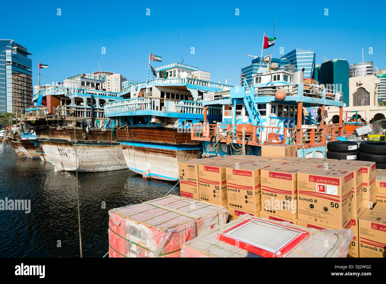Traditional cargo dhows at cargo wharf on The Creek in Dubai United Arab Emirates Stock Photo