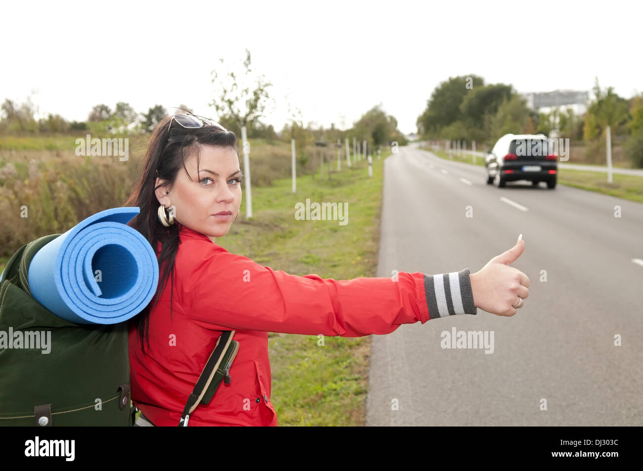 Hitchhiker shows thumb up Stock Photo Alamy