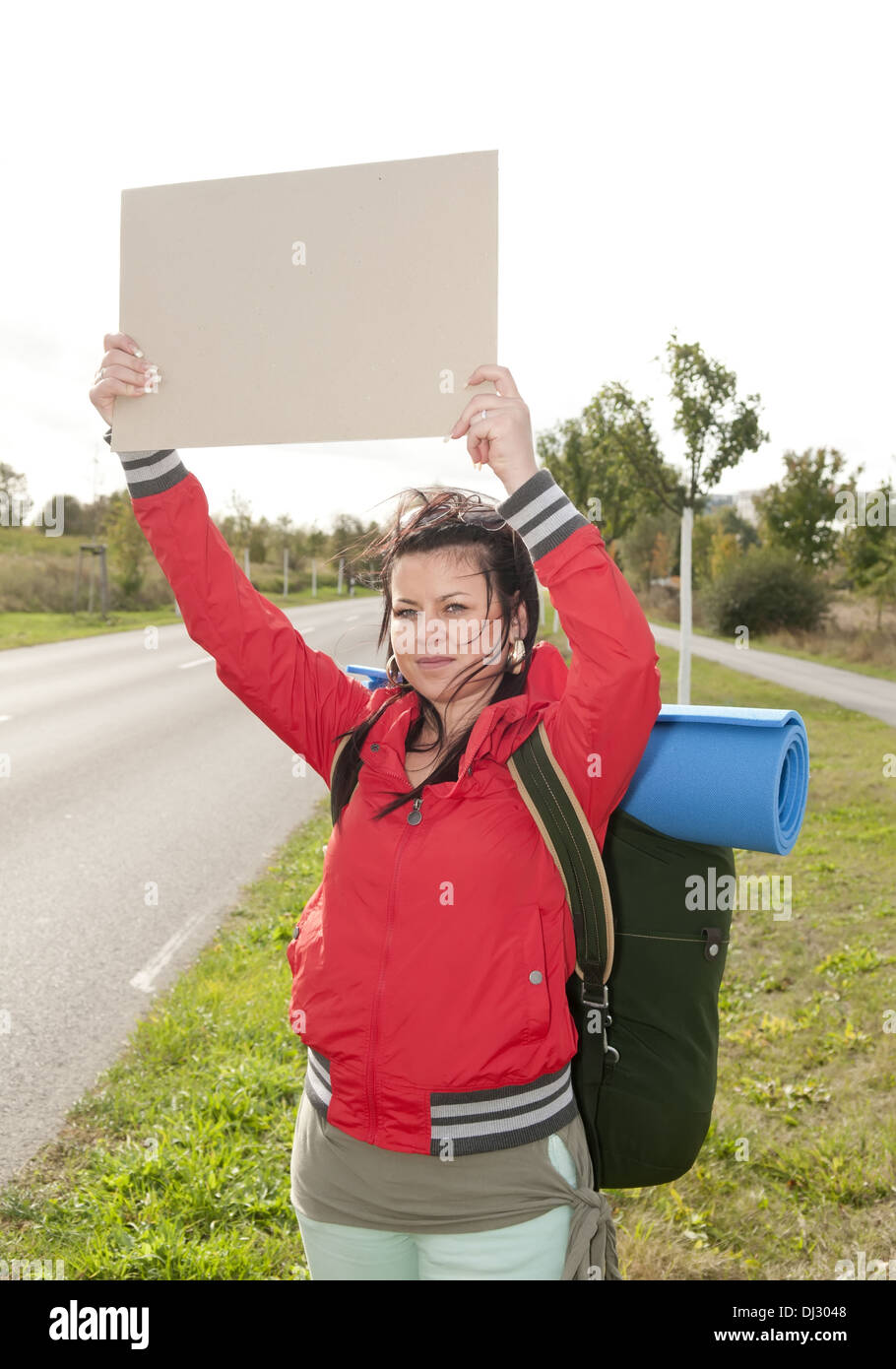 Hitchhiker with blank sign Stock Photo Alamy