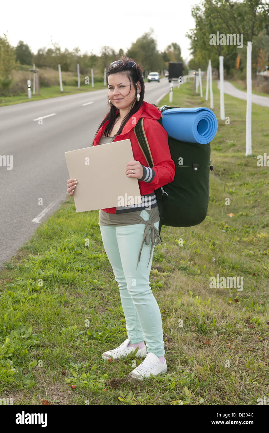 Hitchhiker with blank sign Stock Photo Alamy