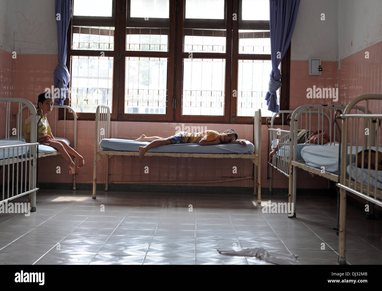 Children with deformed limbs get ready for a daily nap in peace village at Tudu Hospital in Ho Chi Minh City, Vietnam. Stock Photo