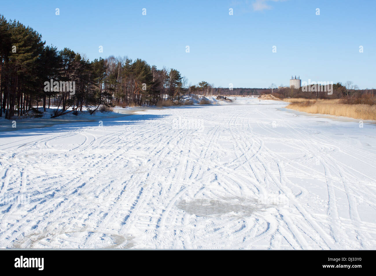 'snowy river' 'frozen river'  winter landscape snow 'ski run' forest blue sky nature 'copy space' Stock Photo