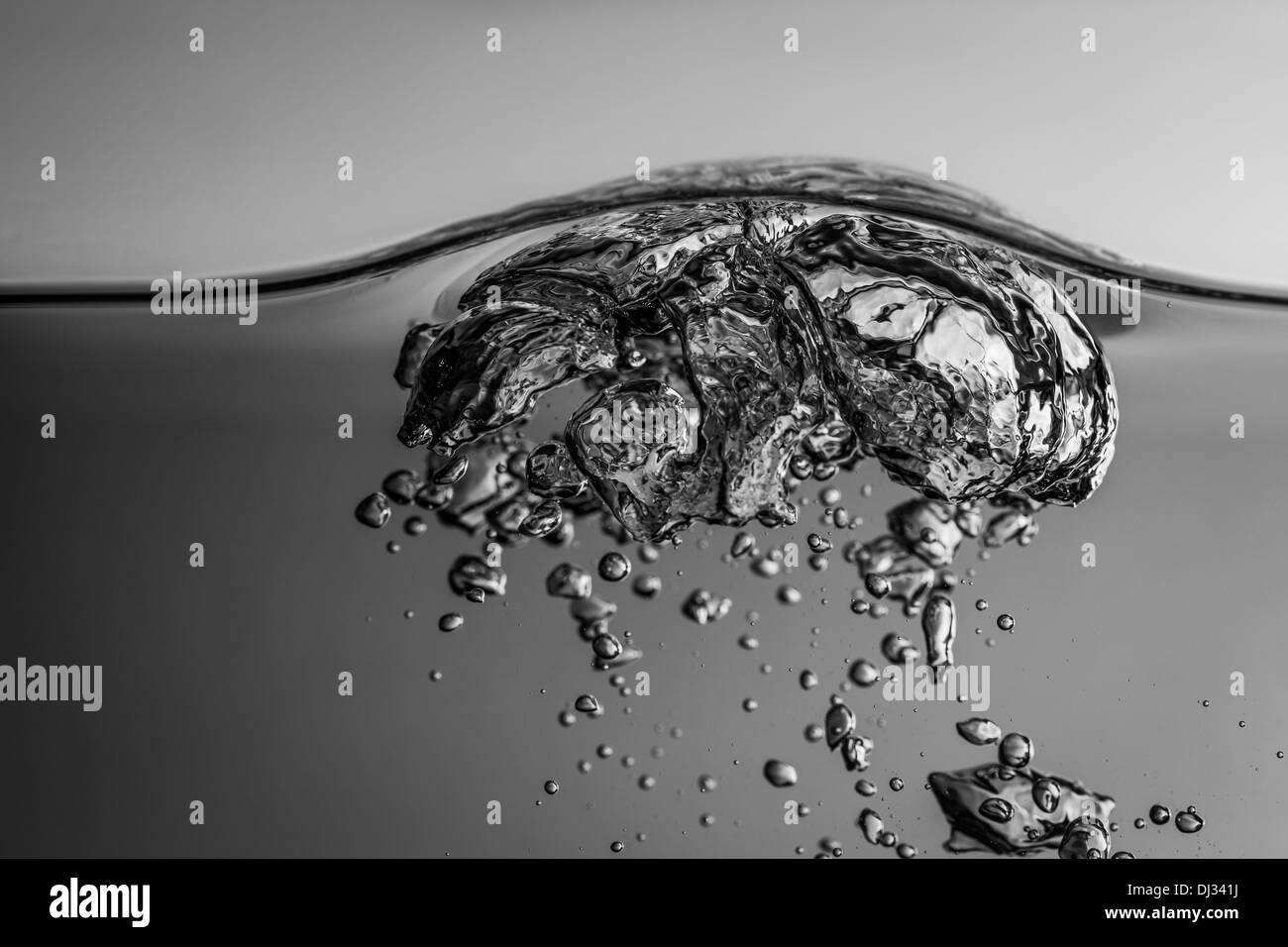 Air bubbles rushing to the waters surface Stock Photo