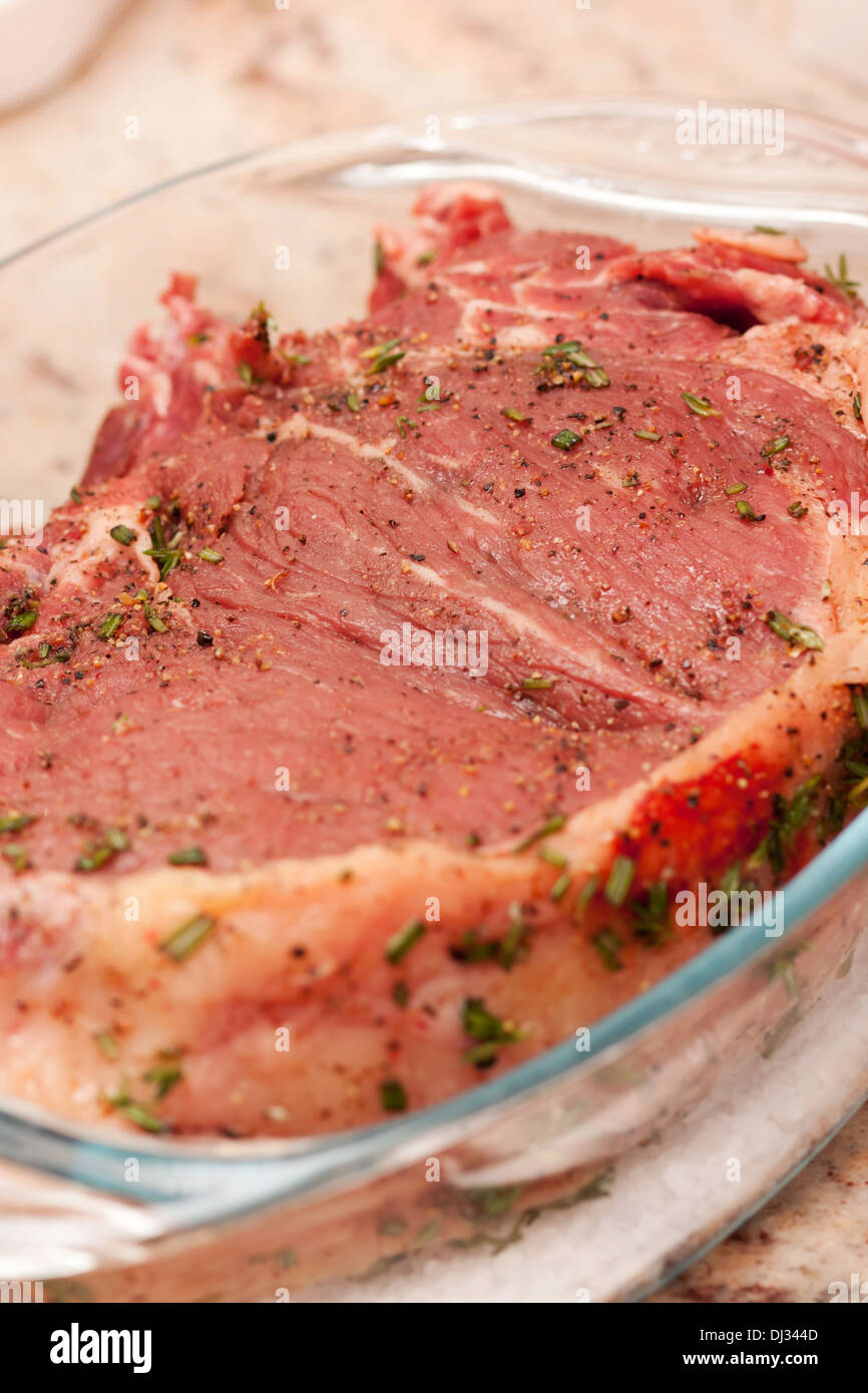 Delicious prime rib marinated with herbs and spices ready to be cooked Stock Photo