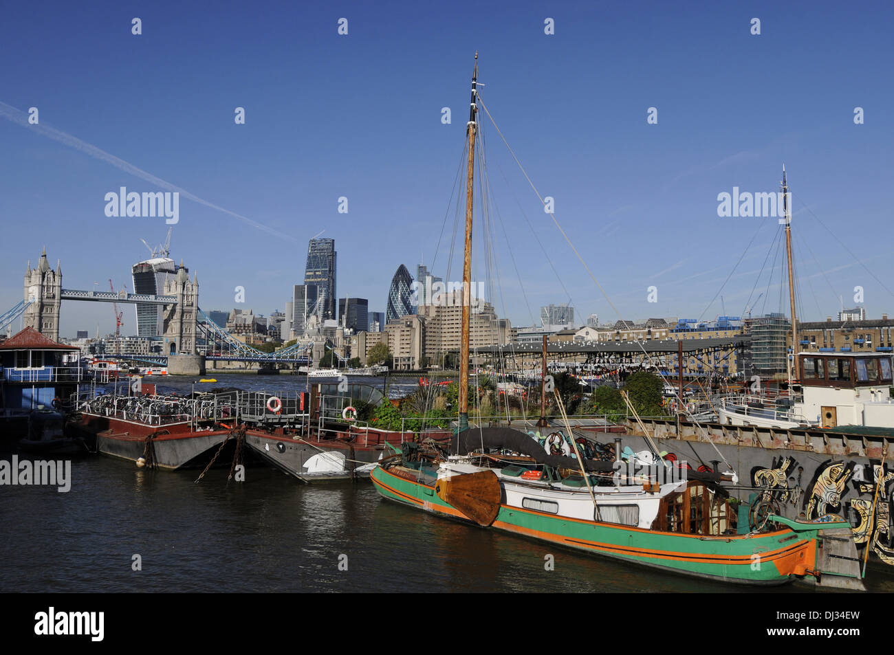 View towards Tower Bridge and City of London from Downings Roads Moorings on the River Thames London England Stock Photo