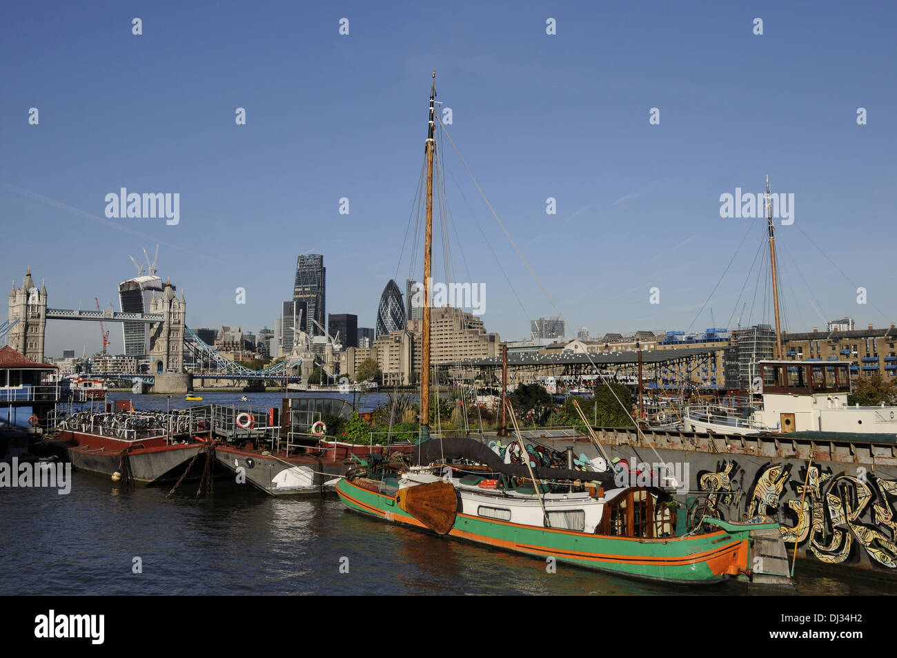 View towards Tower Bridge and City of London from Downings Roads Moorings on the River Thames London England Stock Photo