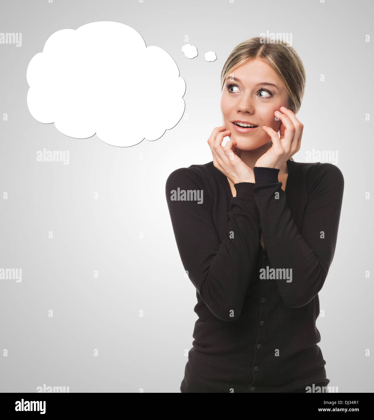 Young woman thinking and looking surprised, with cartoon bubble concept Stock Photo
