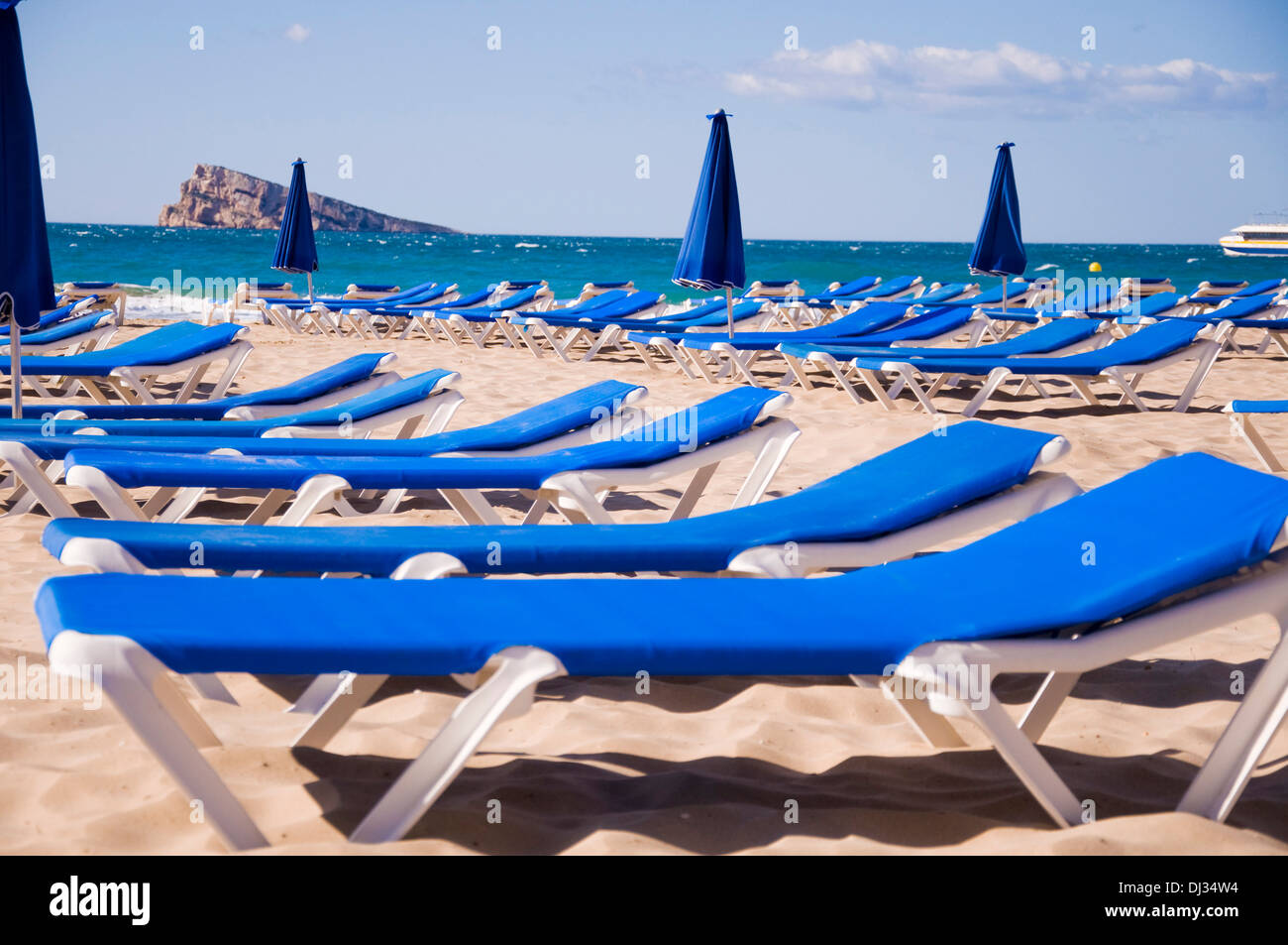 A group of sunbeds in the beach of Benidorm Stock Photo
