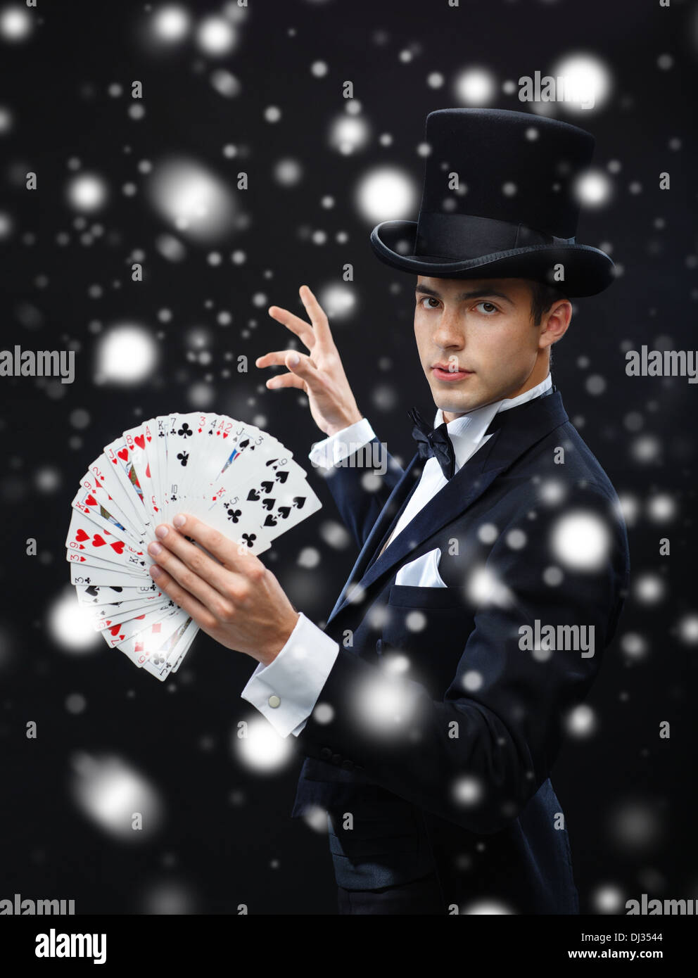 magician showing trick with playing cards Stock Photo Alamy