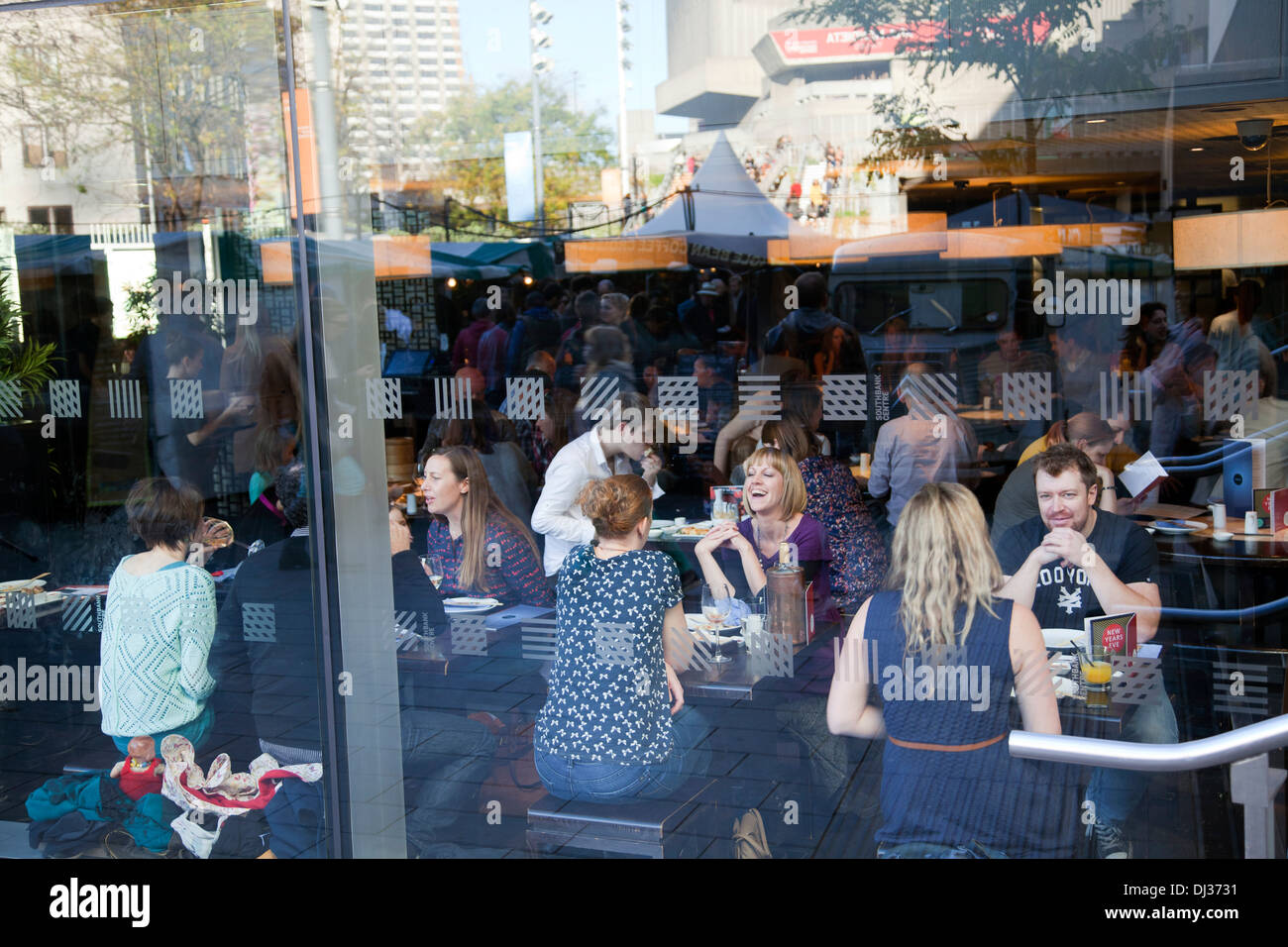 People Dining at Ping Pong Through Window, at Ping Pong Restaurant at Royal Festival Hall in London - UK Stock Photo