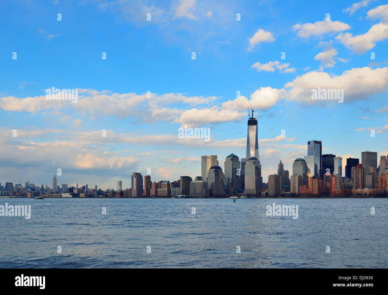 Downtown Manhattan skyline at sunset over Hudson River in New York City ...