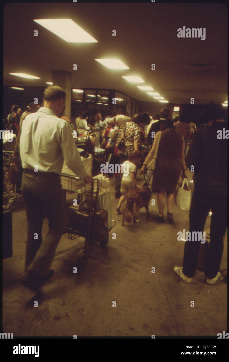 AMTRAK PASSENGERS WITH LUGGAGE GOING TO AND FROM TRAINS IN THE CHICAGO