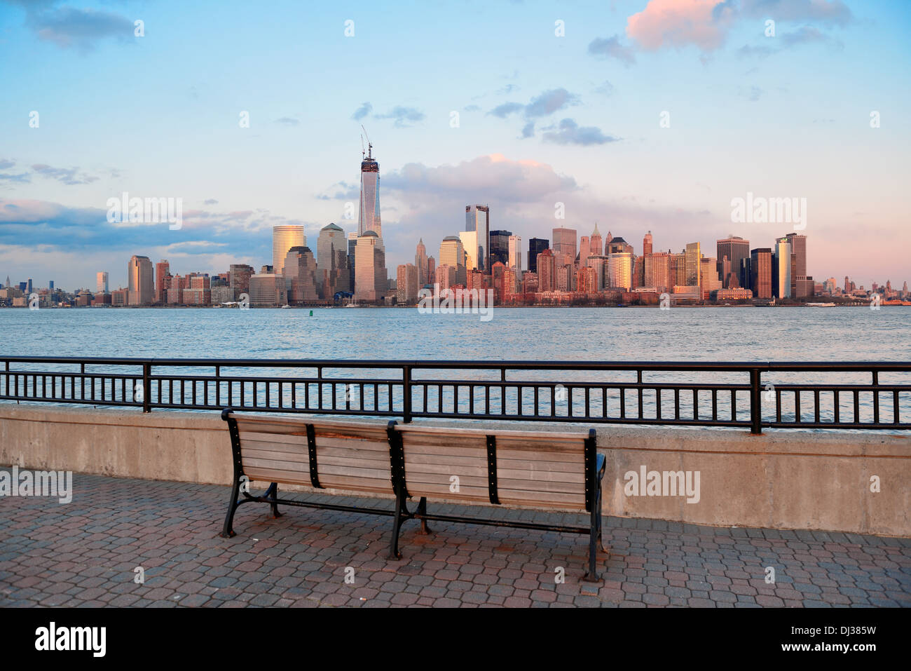 Downtown Manhattan skyline at sunset over Hudson River in New York City ...