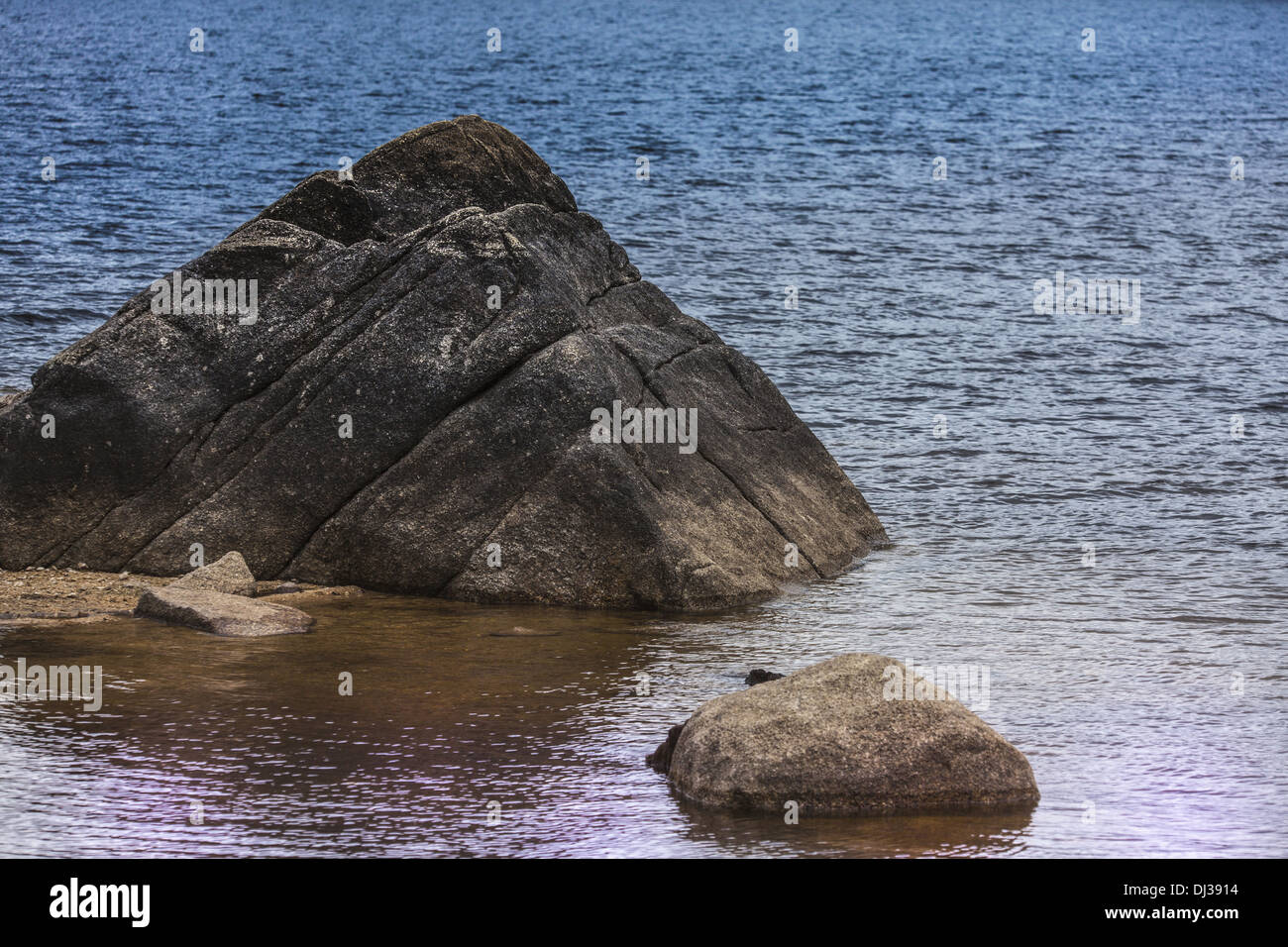 Rock on the water Stock Photo Alamy