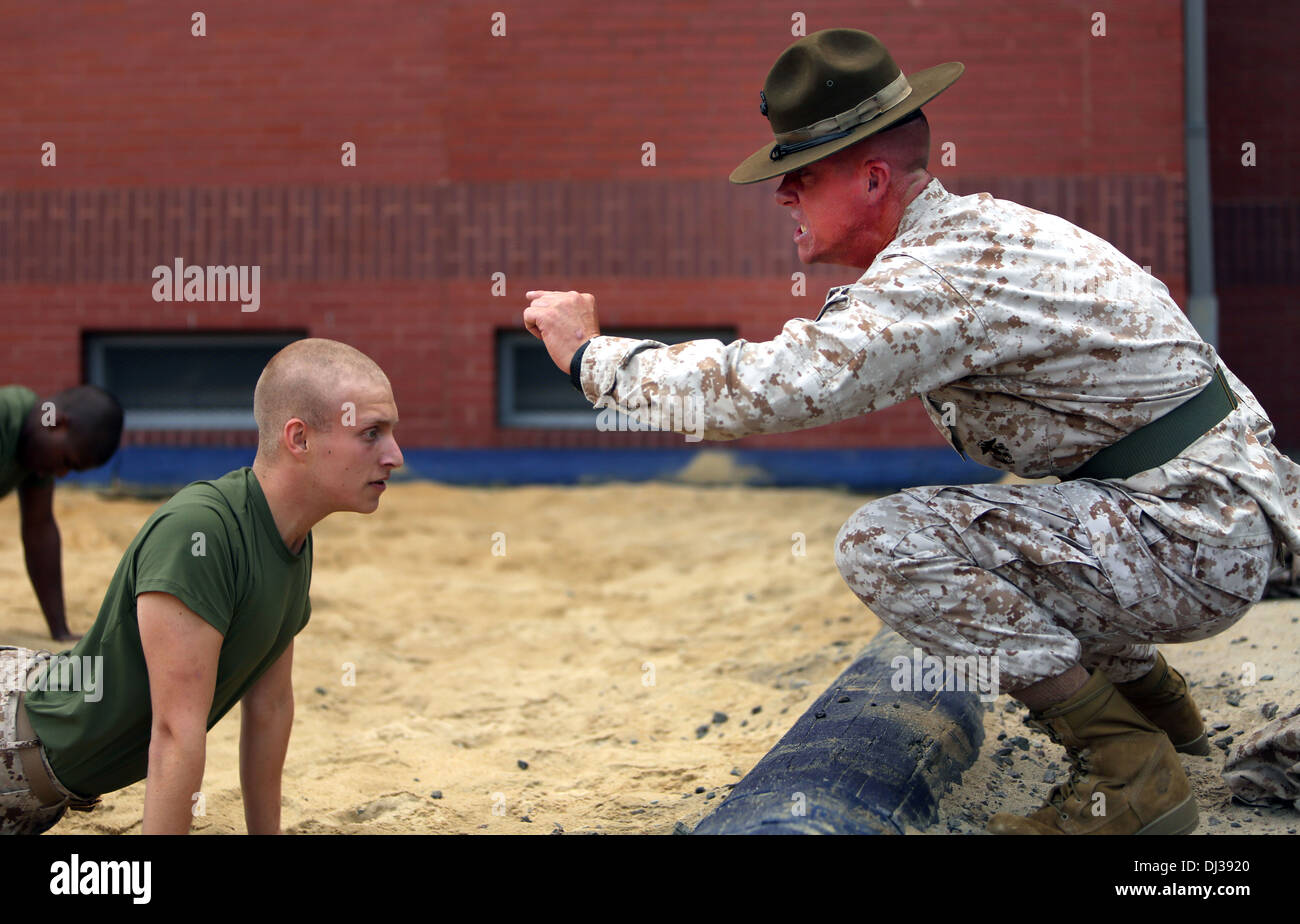 A US Marine Corps drill instructor yells at new recruits during an incentive training session October 30, 2013 on Parris Island, S.C. Stock Photo