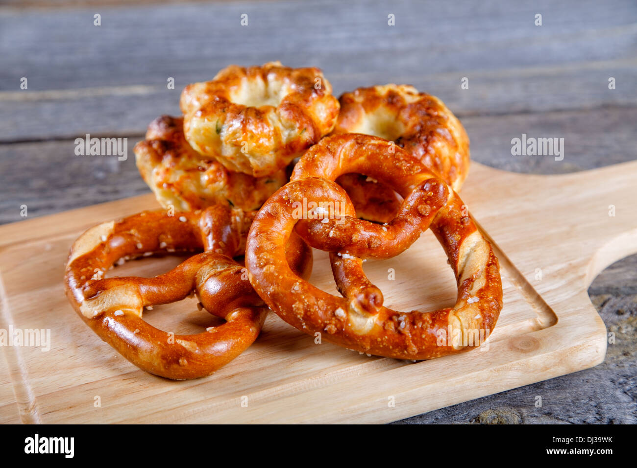 Soft newly-baked rolls on an old kitchen table Stock Photo