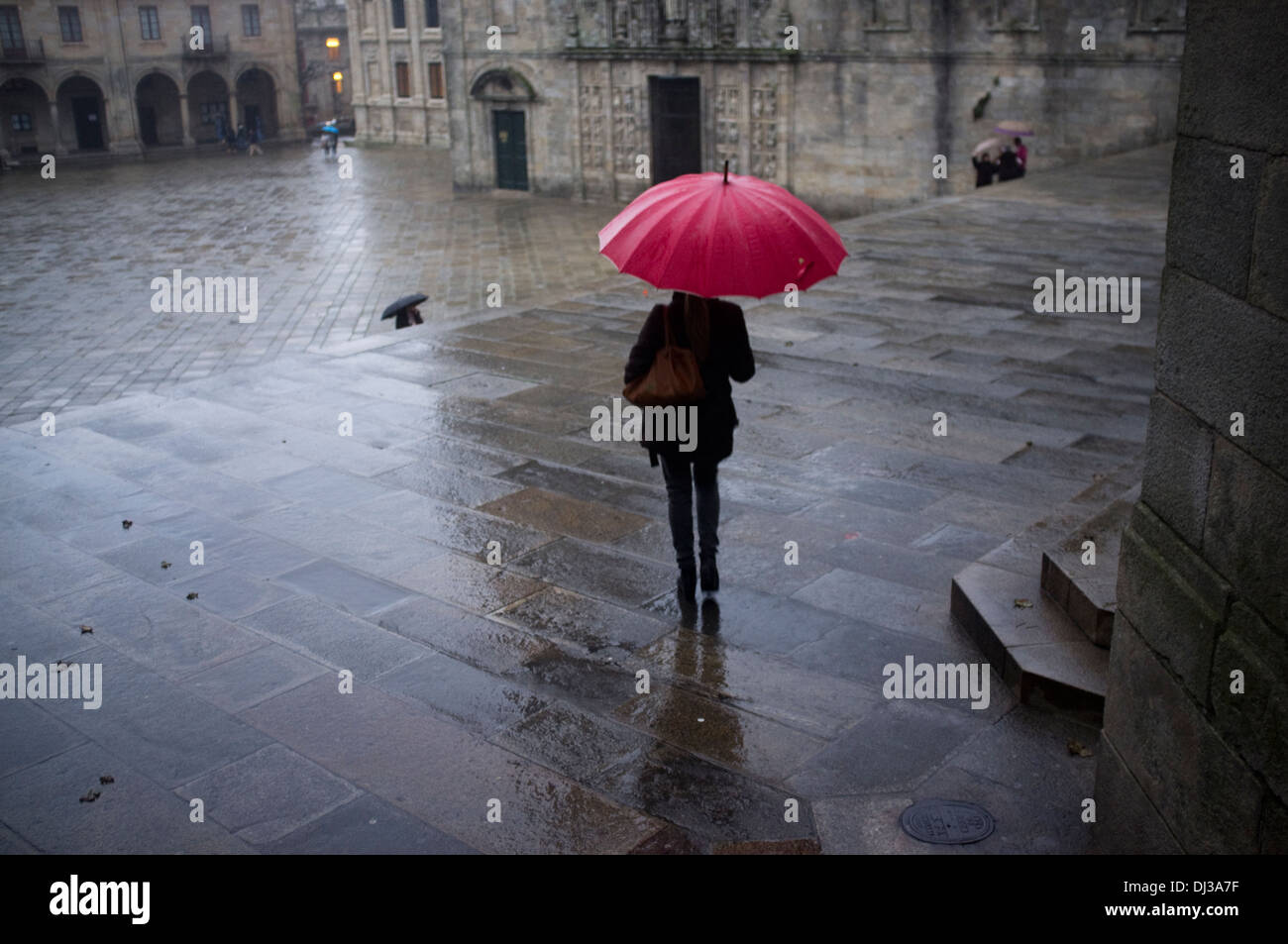 Santiago de Compostela, Galicia, Spain. umbrella rain raining woman Stock Photo