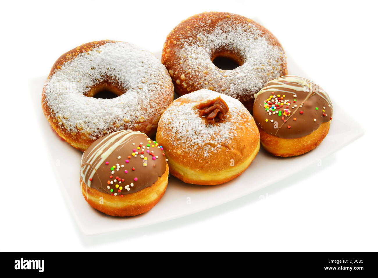 Festive donuts in different sizes. White background. Stock Photo
