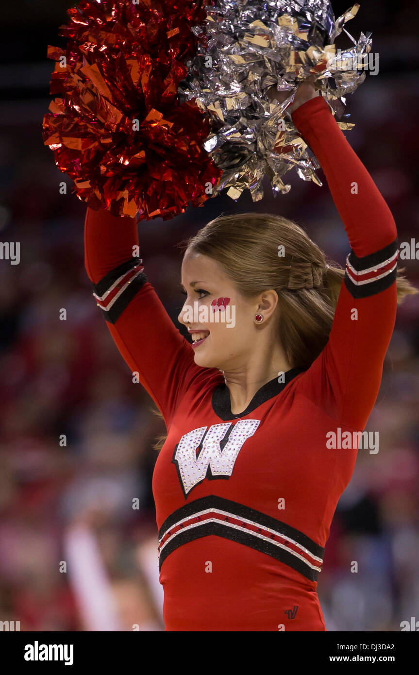 Madison, Wisconsin, USA. 19th Nov, 2013. November 19, 2013: Wisconsin Badger cheerleader entertains the crowd during a timeout during the NCAA Basketball game between the North Dakota Fighting Sioux and the Wisconsin Badgers at the Kohl Center in Madison, WI. Wisconsin defeated North Dakota 103-85. John Fisher/CSM/Alamy Live News Stock Photo