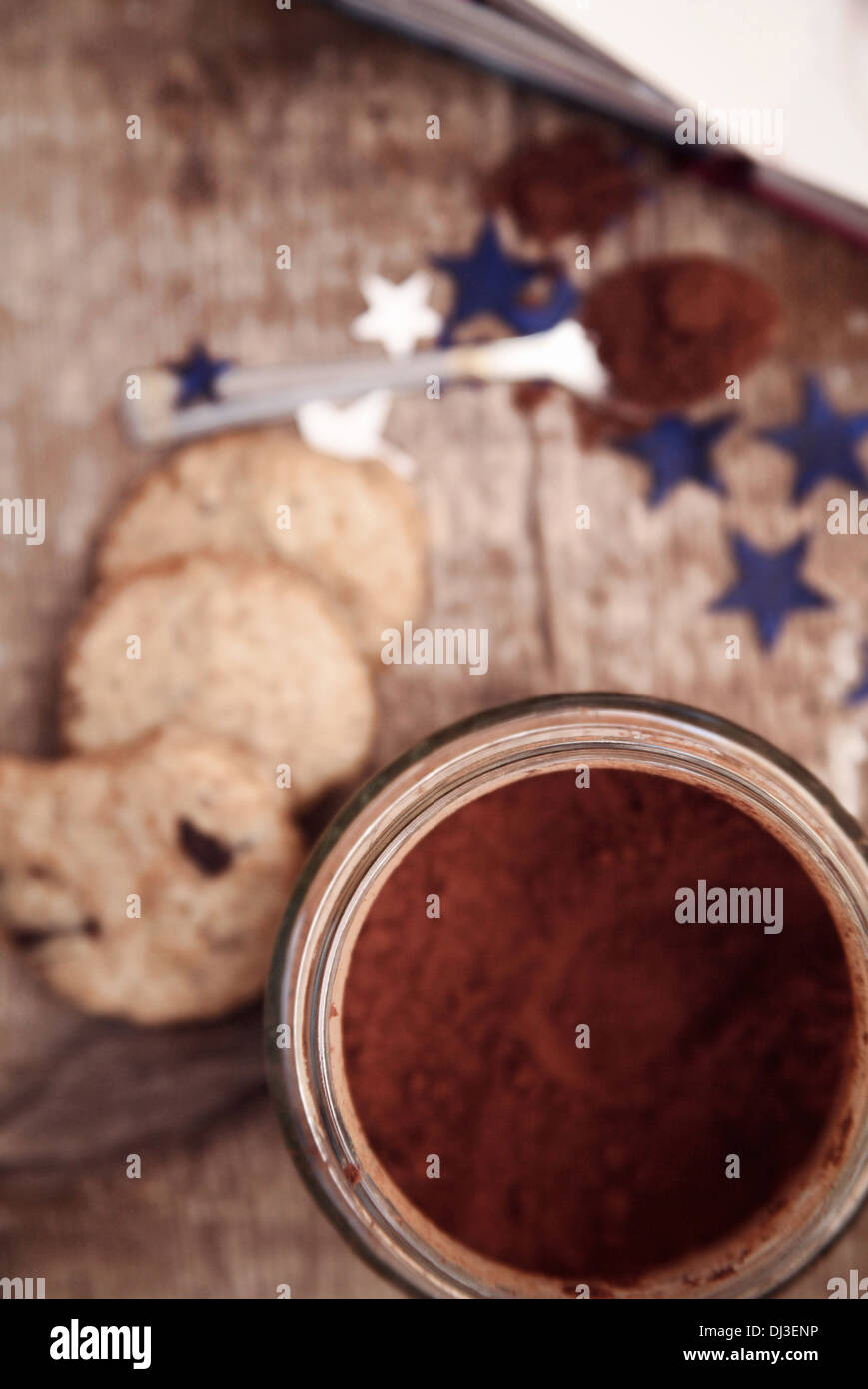 Toned image, cocoa, spoon, cookies and recipe book , wooden background Stock Photo