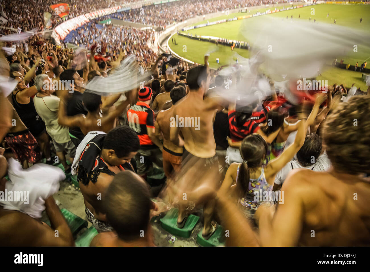 Supporters of Rio football club Flamengo (Clube de Regatas do Flamengo) celebrate a team goal score at the Maracanã stadium. Stock Photo