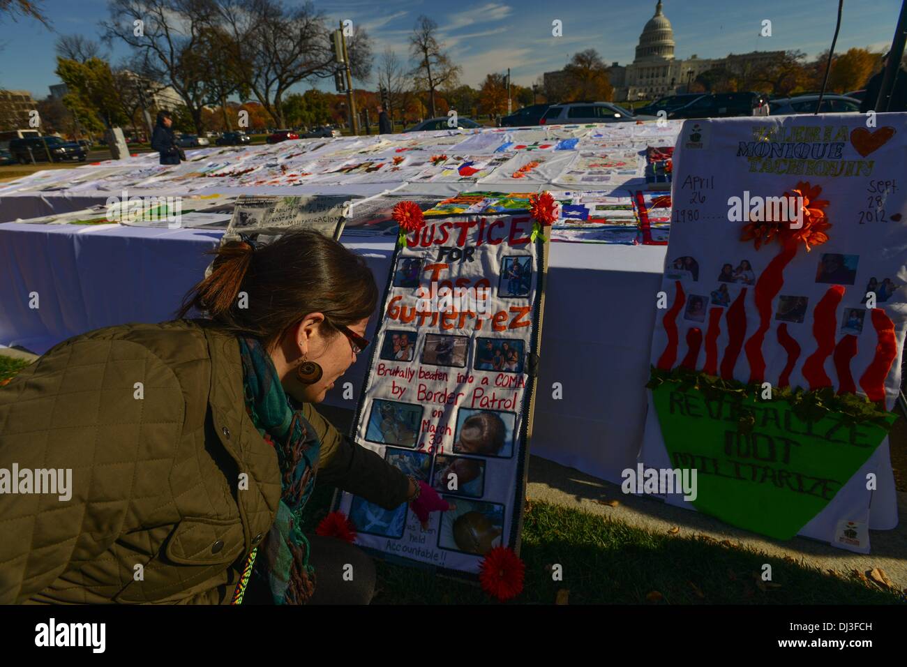 Washington DC, USA. 20th November 2013. SHENA GUTIERREZ, points a photograph in a quilt she made for her husband Jose Gutierrez, who was beaten to coma by Border Patrol Agents in March 2011. while attemping to cross the border in Arizona. While in the hospital, border agents attempted to deport Jose to Mexico. He lost part of his skull and suffers from seizures, when feeling good he plays with rock band El Tri and FZ10 songs about immigration and unjustice. Credit:  ZUMA Press, Inc./Alamy Live News Stock Photo