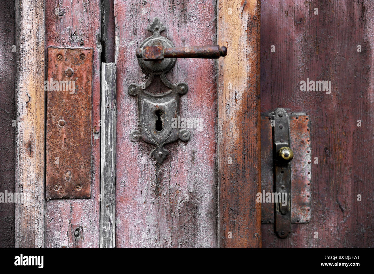 Old and rusty door handle and door lock Stock Photo