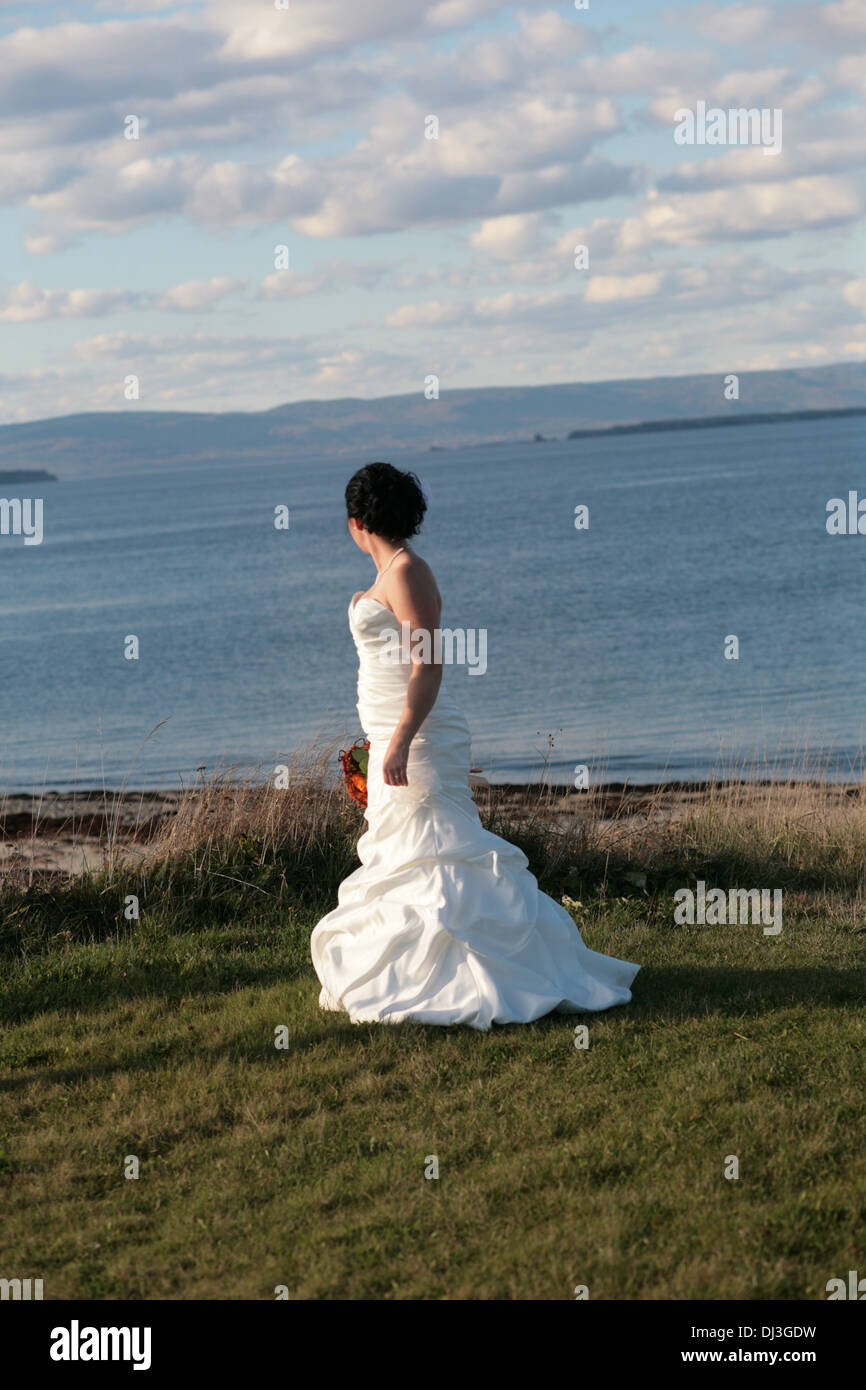 A bride looking off a cliff Stock Photo - Alamy