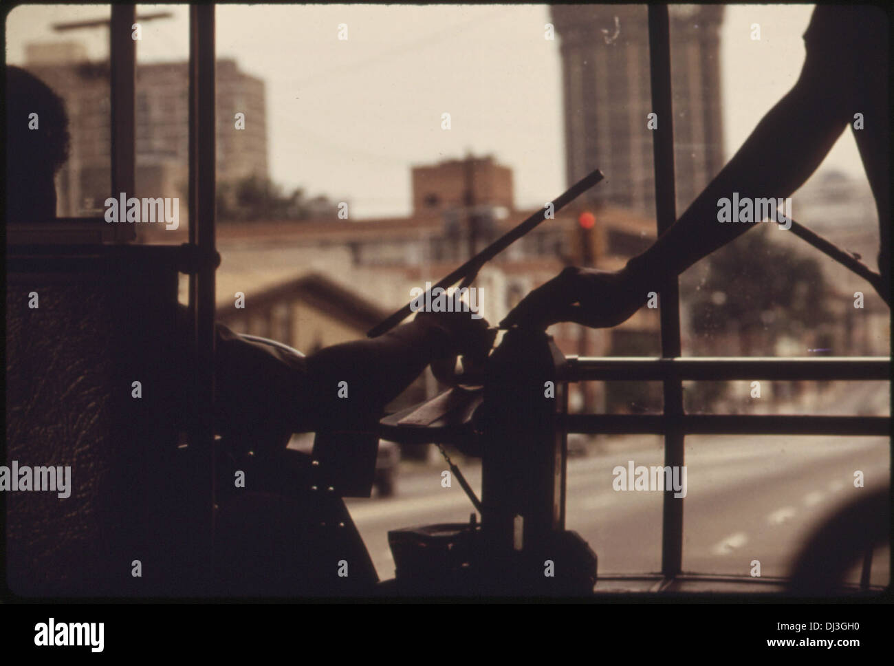 PASSENGER DEPOSITS HER FARE ON A METROPOLITAN ATLANTA RAPID TRANSIT