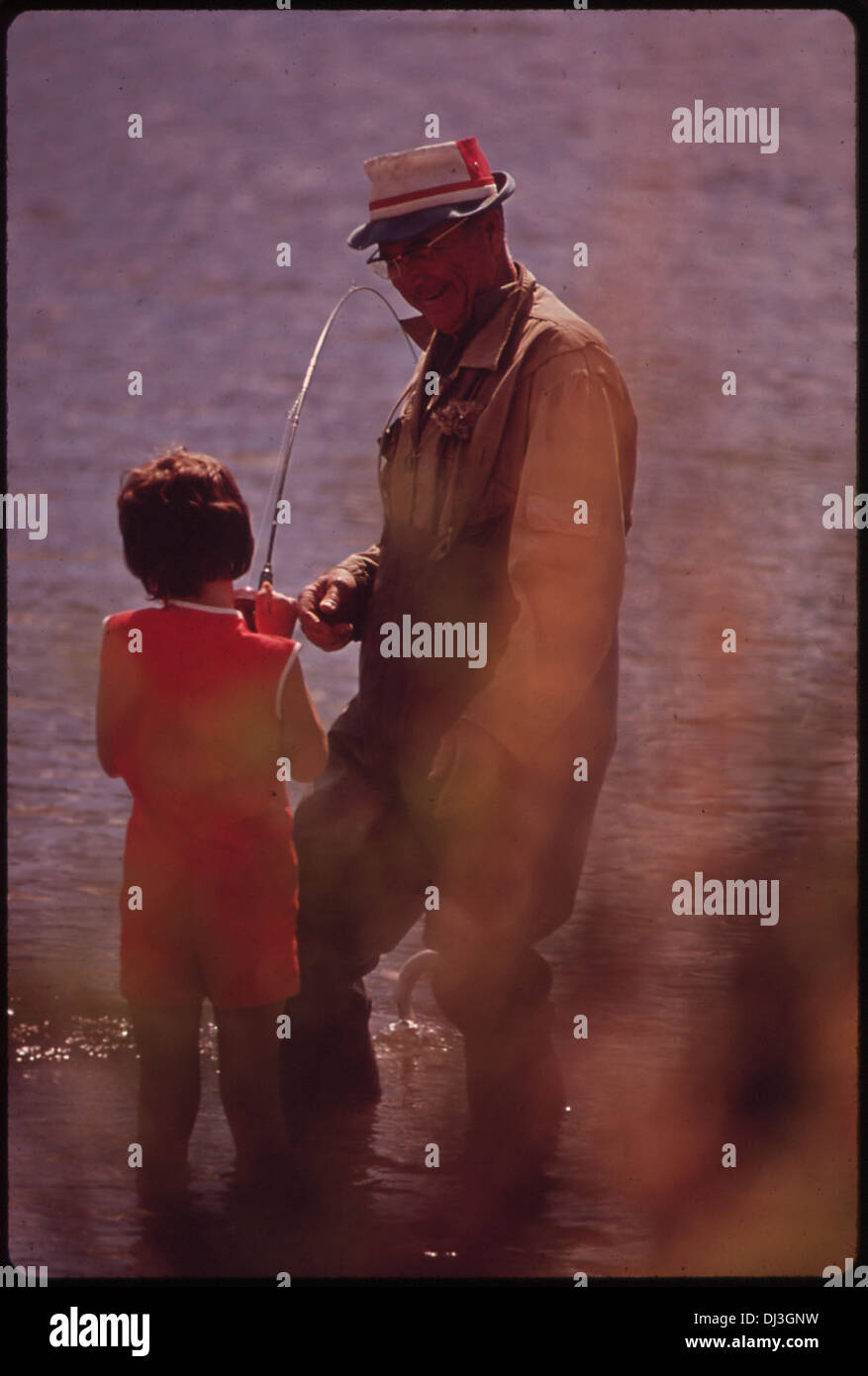 SHANA IS TAUGHT TO FISH BY HER GRANDFATHER AT MAN-MADE MIRAMONTE LAKE 693 Stock Photo