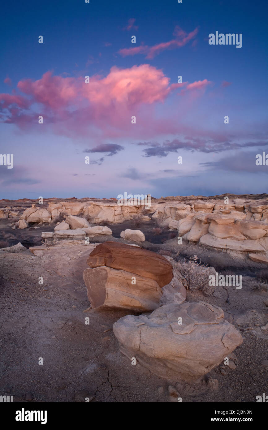Rock formations and Hoodoos during sunset in the Bisti/De-Na-Zin Wilderness, New Mexico, USA. Stock Photo