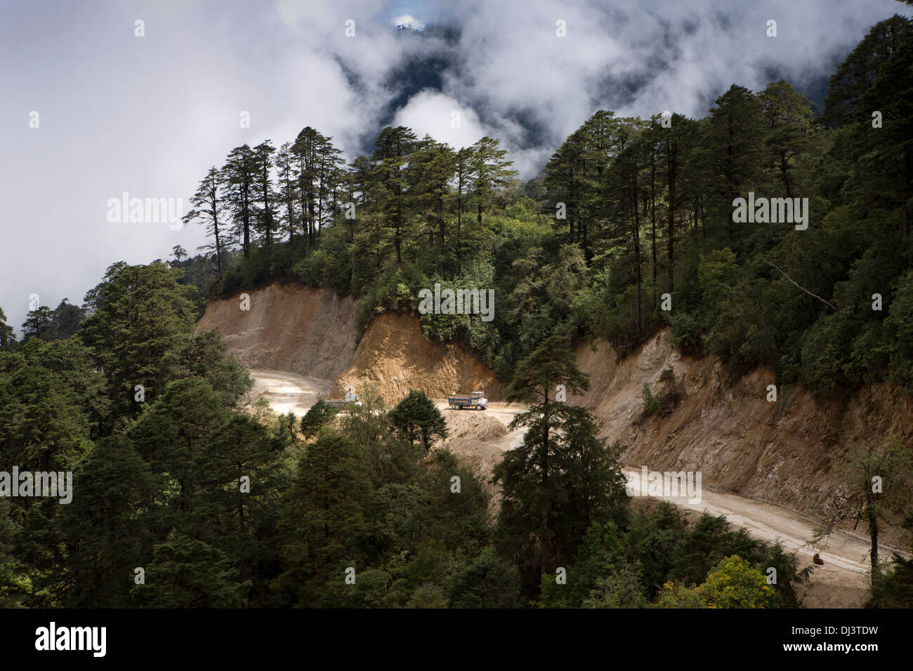 Bhutan, Dochu La pass, trucks on high altitude roads as cloud closes in Stock Photo