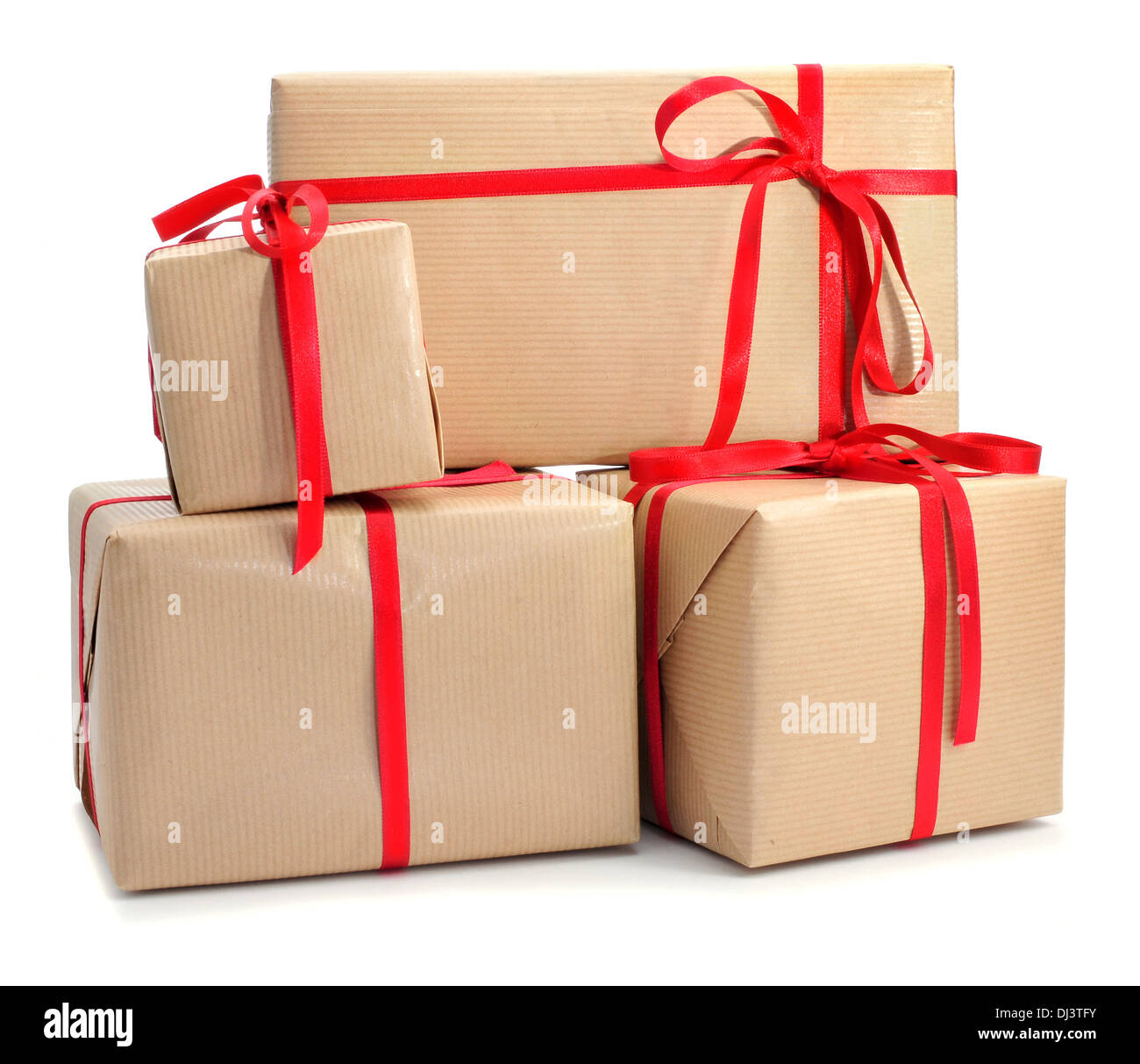 a pile of gifts with a red ribbon on a white background Stock Photo