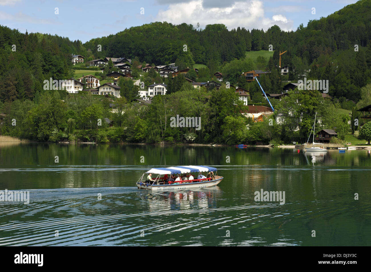 excursion boat crossing lake Fuschl, Austria Stock Photo