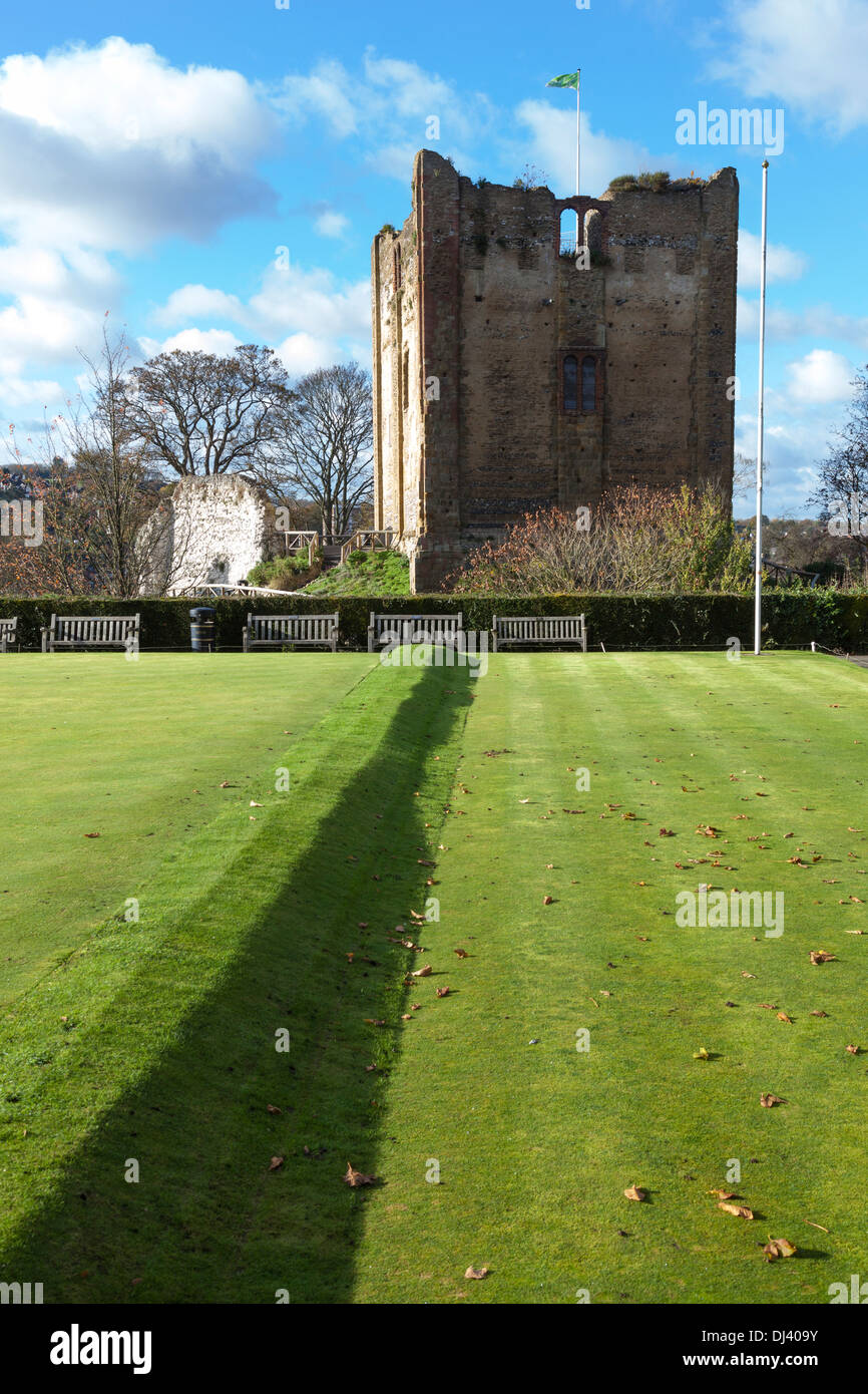 The remains of the keep of Guildford Castle (Norman origins), with the bowling green of Castle Green Gardens in the foreground. Stock Photo