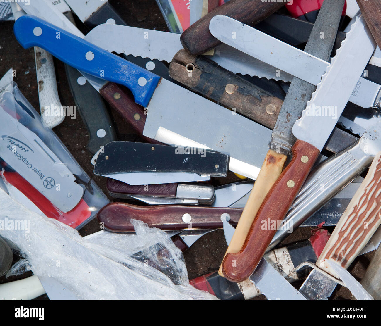 A pattern or background of kitchen and pocket knives Stock Photo