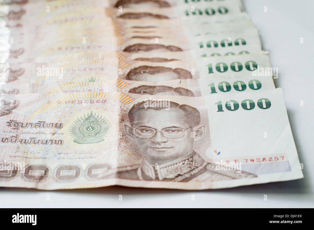 Close up of thailand currency, thai baht with the images of Thailand King. Denomination of 1000 bahts. Stock Photo