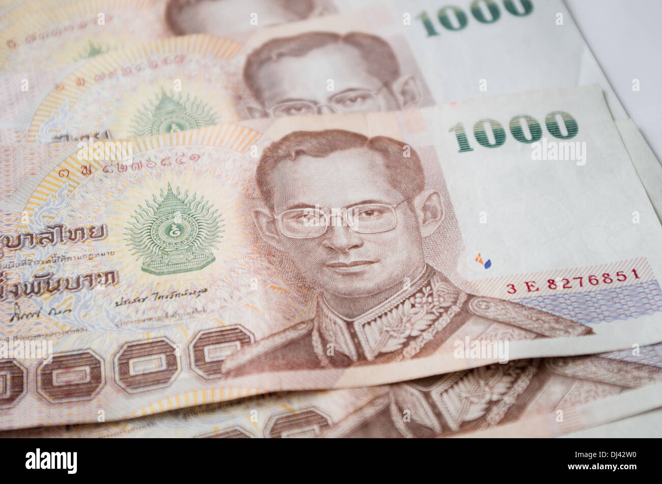 Close up of thailand currency, thai baht with the images of Thailand King. Denomination of 1000 bahts. Stock Photo