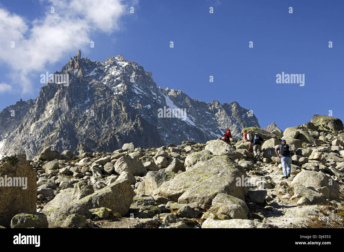 Hikers below the peak Le Portelet, Valais Stock Photo