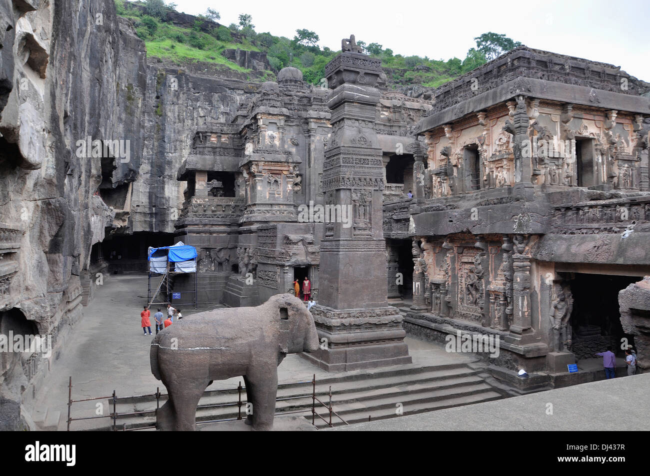 Cave 16 : Temple Courtyard and Victory Pillar North. Narasimha on the south wall. Ellora Caves, Aurangabad, Maharashtra, India Stock Photo