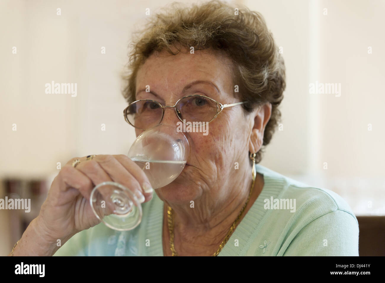 Senior Woman with a Water Glass Stock Photo