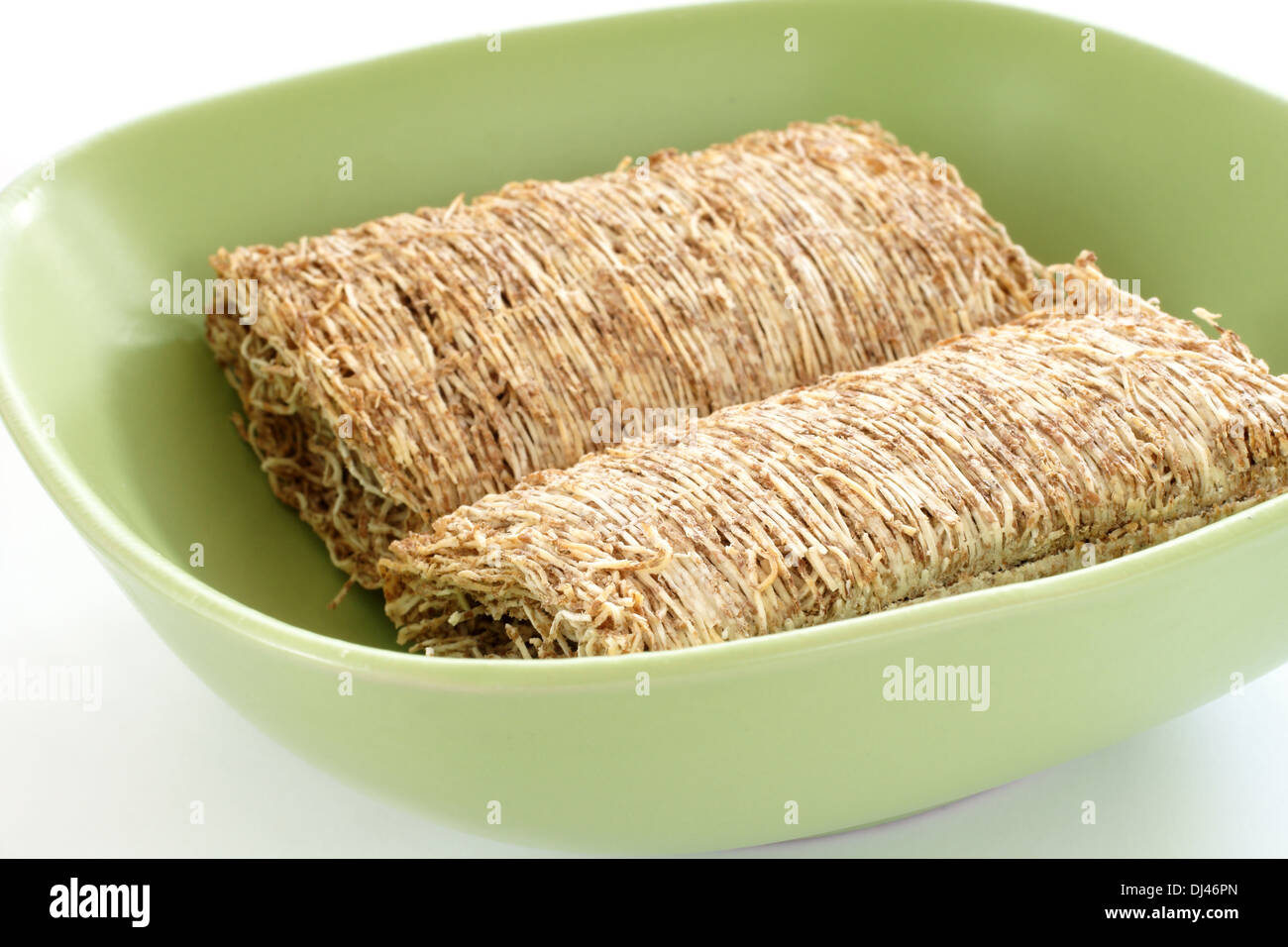 Shredded wheat biscuits in a breakfast bowl Stock Photo