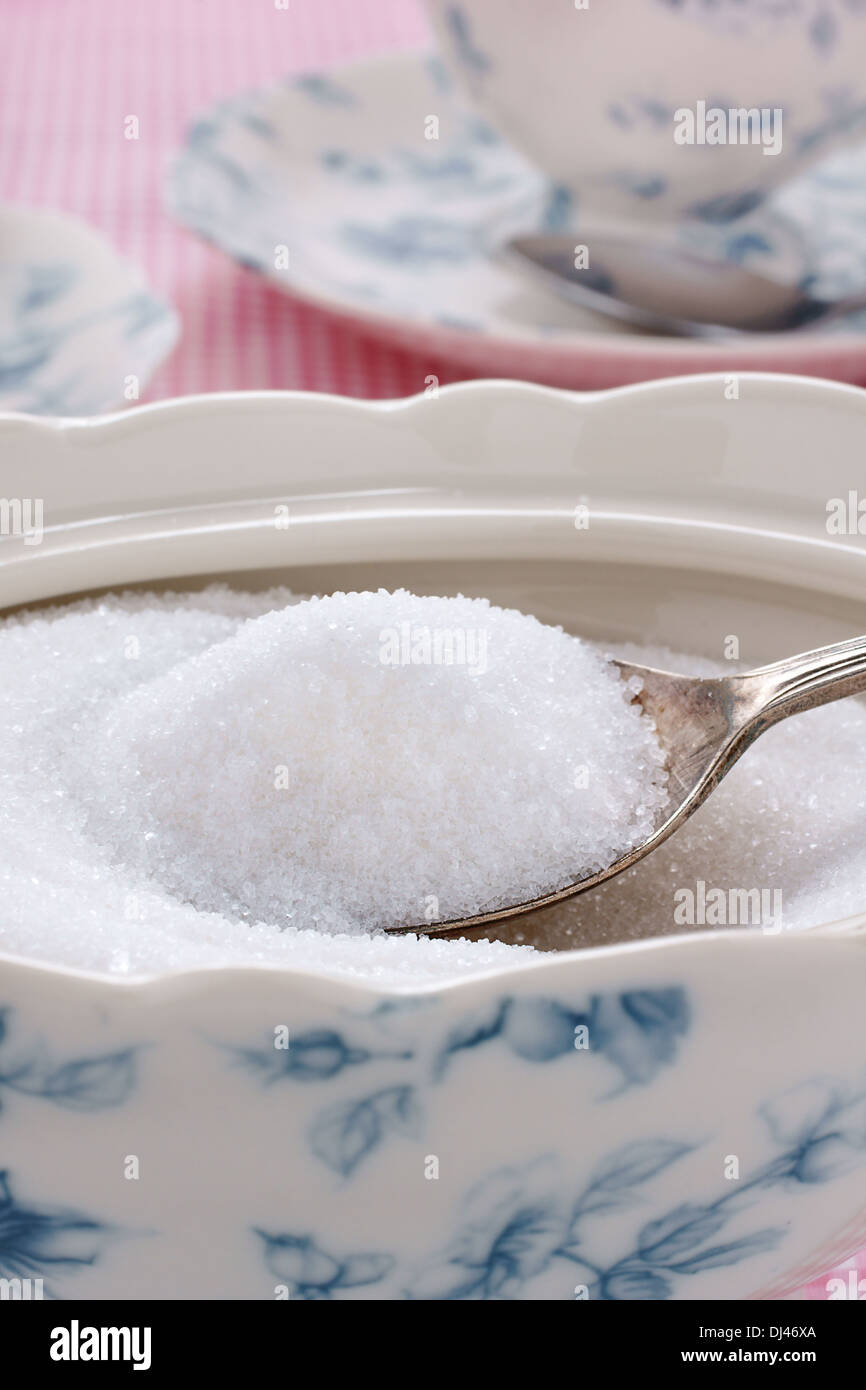 Spoonful of sugar in a sugar bowl Stock Photo