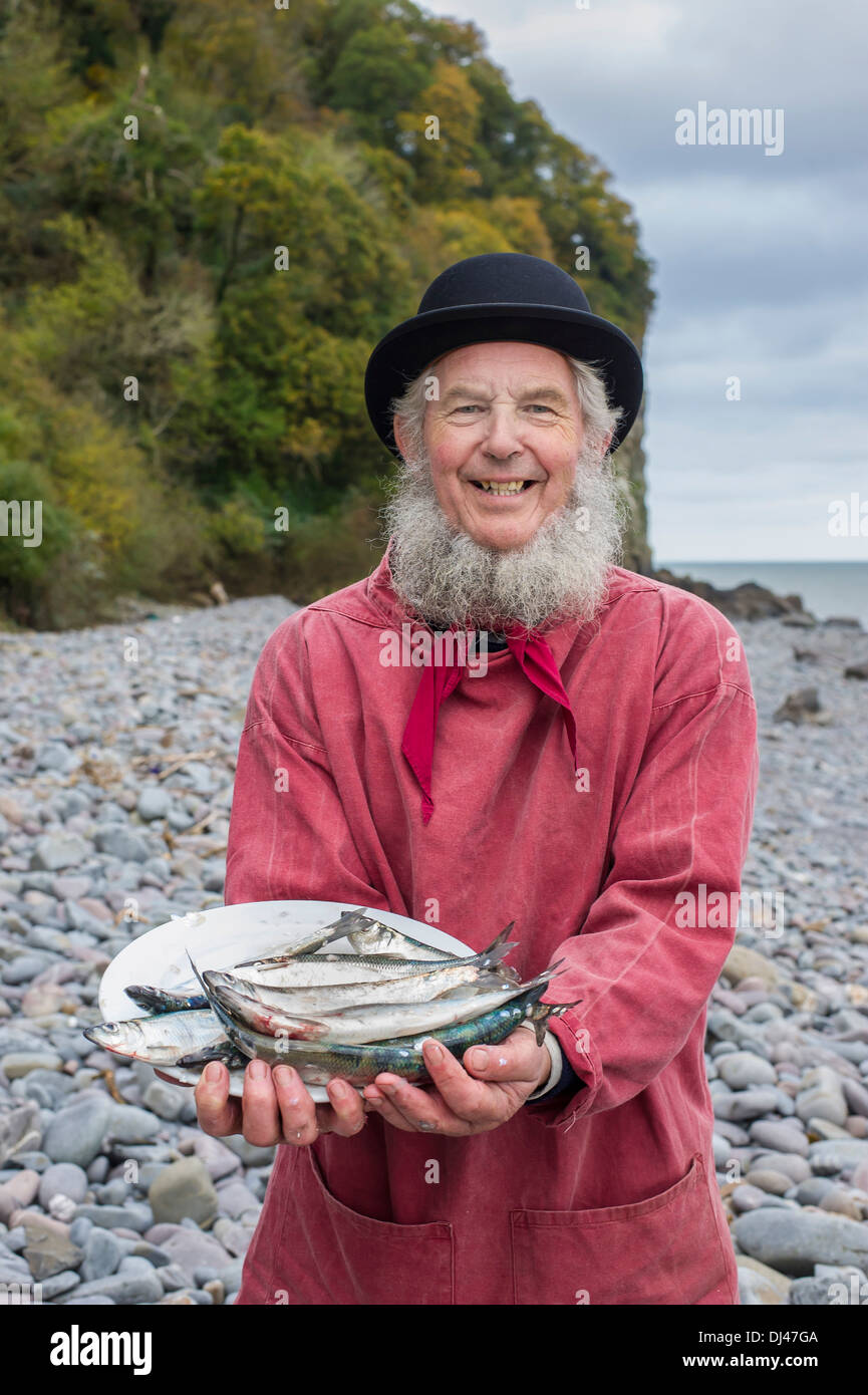Fisherman Chris Braund with a plate of herring for the annual Clovelly