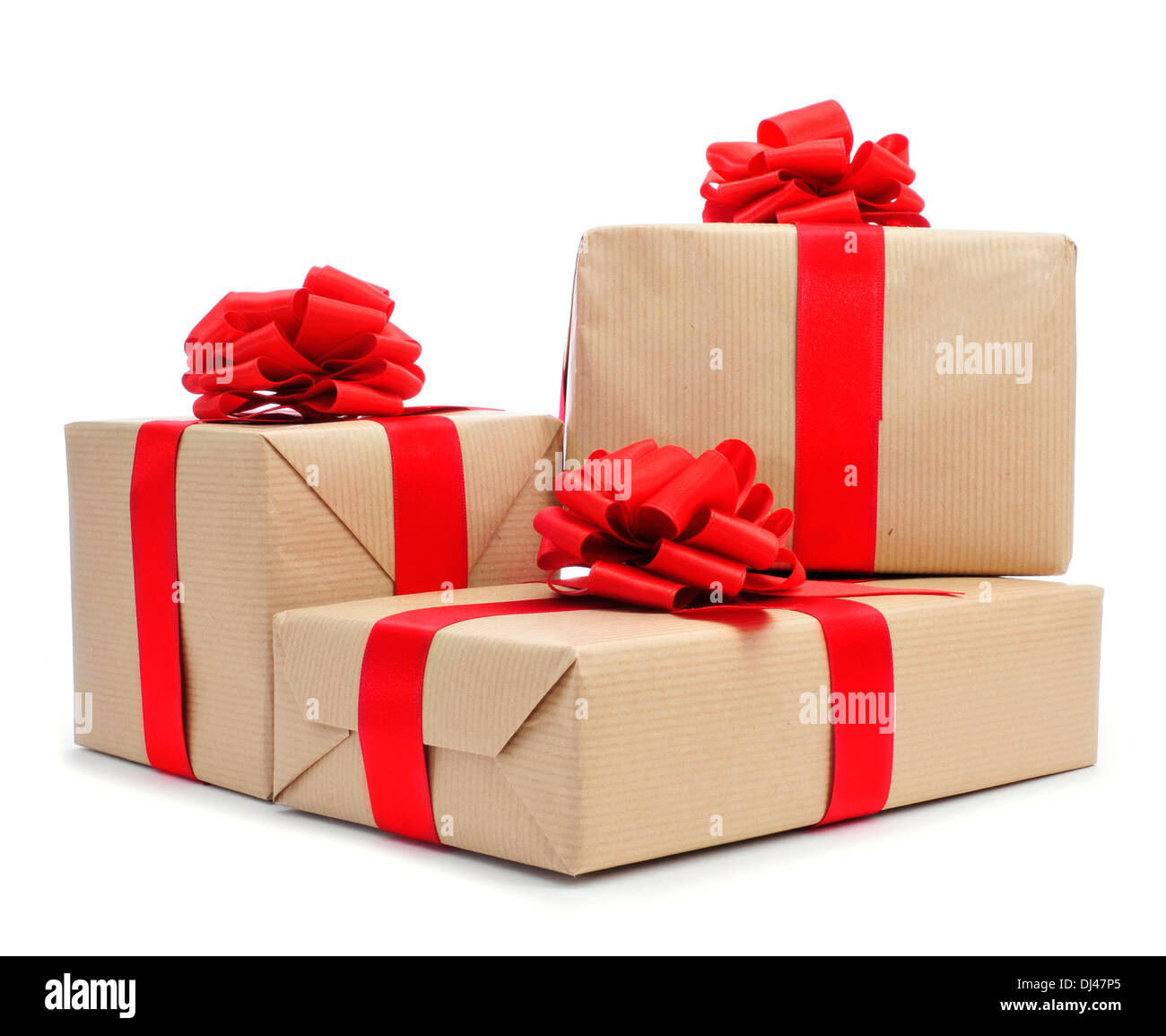 a pile of gifts with red ribbon bows on a white background Stock Photo
