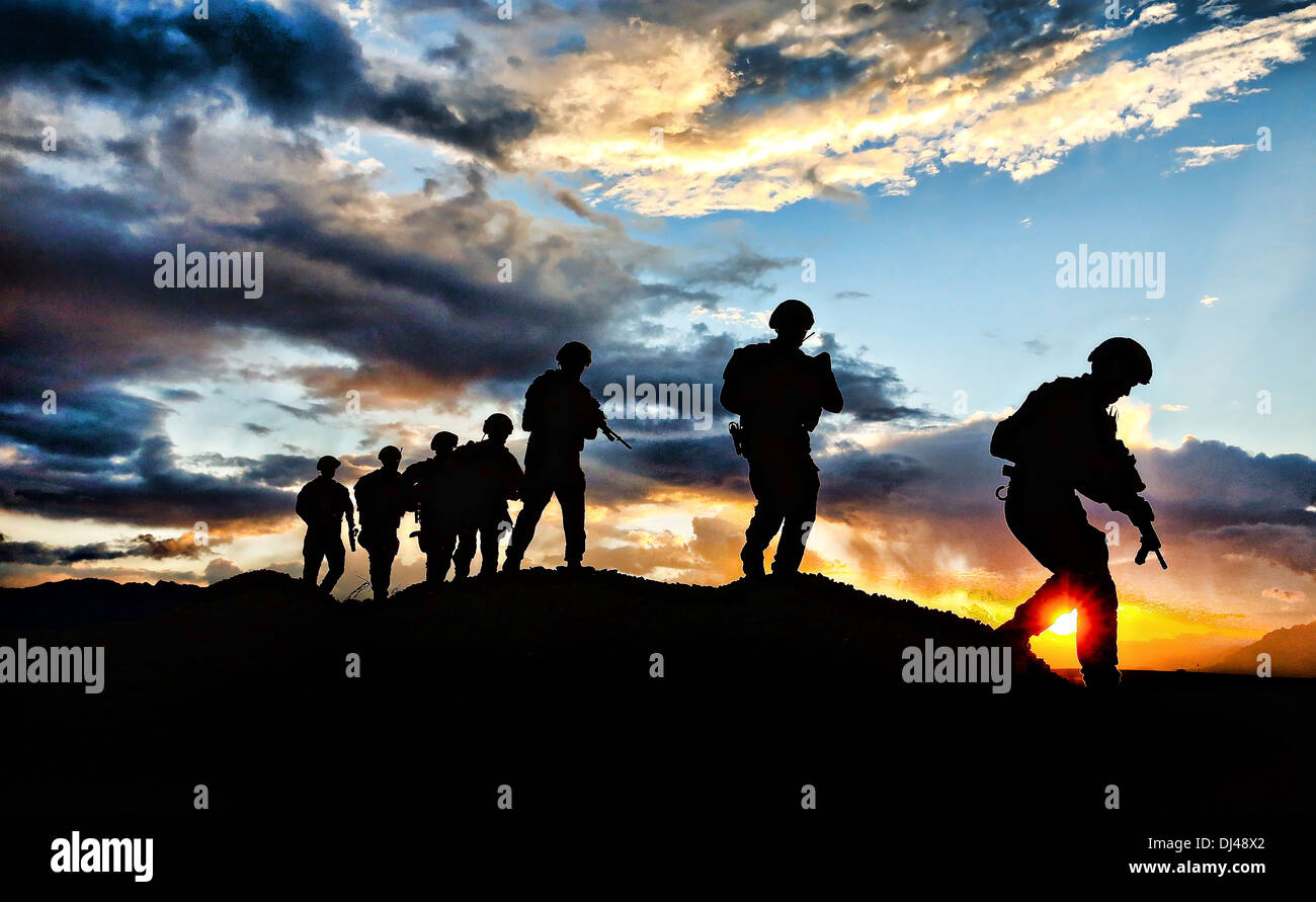 Australian army soldiers with the The Royal Australian Regiment patrol at sunrise November 6, 2013 at Multinational Base Tirin Kot, Uruzgan province, Afghanistan. Stock Photo